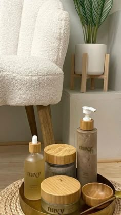 a white chair sitting next to a pile of personal care items on top of a wooden tray