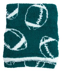 a green rug with white circles on it