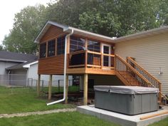 a house with a hot tub in the yard