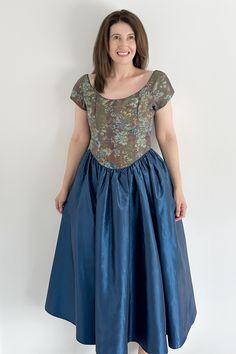 🤍 VINTAGE LAURA ASHLEY BLUE TAFFETA AND TAPESTRY OCCASION PARTY MIDI DRESS 🤍 Step into elegance with our vintage Laura Ashley blue taffeta and tapestry midi dress! Inspired by the regal charm of Bridgerton, this dress is destined to make you the star of any evening event, wedding, or Christmas party. With its luxurious fabrics and timeless design, you'll exude sophistication and style wherever you go. **WELCOME TO SEASONALLY DRESSED** BRAND ~ LAURA ASHLEY (VERY RARE) HISTORY: Was featured in the 2000 Laura Ashley Christmas Catalogue  👗 Size: UK 14 today | UK M Label is a UK 14 | EUR 40 | USA 10 Model is a UK 12 Underarm to underarm (Flat): 20" Waist (Circumference): 32" Hips (Circumference): free  Shoulder to Hem: 49" ⭐️ ITEM DESCRIPTION ⭐️ 90s | Tapestry | Blue taffeta | Layered and ne Fitted Blue Vintage Dress For Costume Party, Laura Ashley Christmas, Aesthetic Attire, Netted Skirt, Vintage Christmas Party, Rare Dress, Blue Tapestry, Wash Label, Vintage Laura Ashley