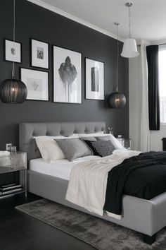 a bedroom with gray walls and pictures on the wall above the bed, along with an area rug