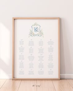 a wedding seating chart is displayed in front of a white wall with a wooden frame