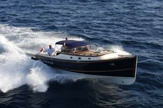 two men on a motor boat in the water