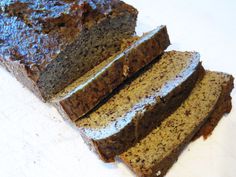 sliced loaf of banana bread sitting on top of a cutting board