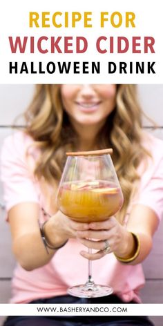 a woman holding a wine glass with the words recipe for witches cider halloween drink