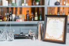 the table is set with glasses and menus