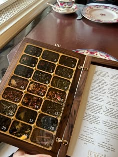 an open wooden box filled with lots of numbers