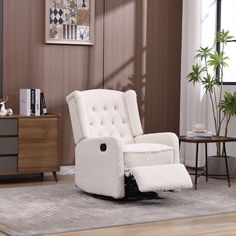 a white recliner chair sitting on top of a rug