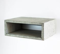 an empty concrete box hanging on the wall