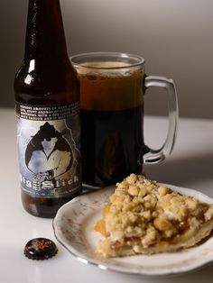 a plate with food and a beer next to it