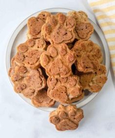 a white plate topped with cookies on top of a table