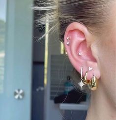 a close up of a person with ear piercings