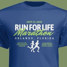 the run for life marathon t - shirt is blue with green and white lettering on it