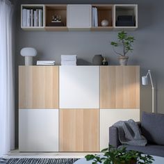 a living room filled with furniture and bookshelves on top of it's shelves