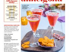 a magazine with two glasses of wine and chips