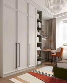 a bedroom with white cupboards and an area rug on the floor in front of it