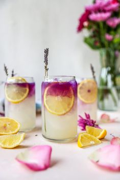 three glasses filled with lemonade and lavender