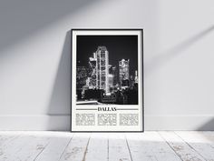 a black and white photo of a cityscape with the word dallas printed on it