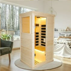 a wooden sauna in the middle of a living room