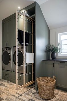 a laundry room with washer and dryer in it