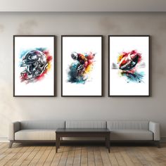 three framed art prints on the wall above a couch