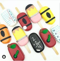 several popsicles with different designs on them are arranged in the shape of fruits and vegetables