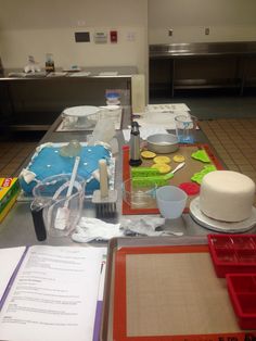 a kitchen counter topped with lots of different types of food and utensils on top of it