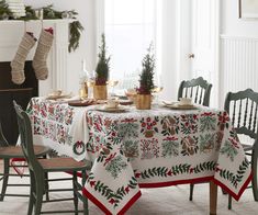 a dining room table covered in christmas decorations