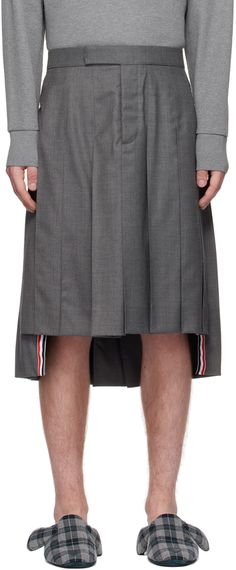 Wool twill skirt. Pleats throughout. · Button-fly · Signature tricolor grosgrain trim at hem · Adjustable buttoned tab at back waistband · Signature tricolor grosgrain flag at back waistband · Full plain woven lining Supplier color: Medium grey Bridal Party Glasses, Guys In Skirts, Casual Shorts For Men, Twill Skirt, Gender Neutral Clothes, Party Glasses, Box Pleat Skirt, Pleated Midi Skirt, Gray Skirt