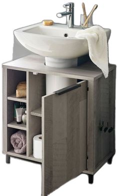 a white sink sitting next to a wooden cabinet