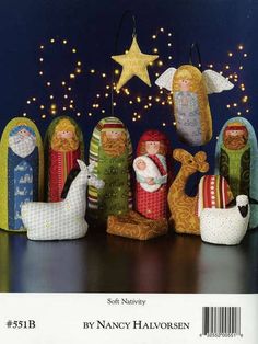 a group of nativity figurines sitting on top of a table