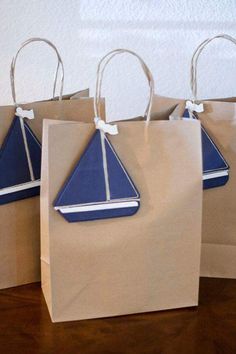 some paper bags with blue and white designs on them