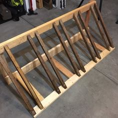 a wooden rack is sitting on the floor