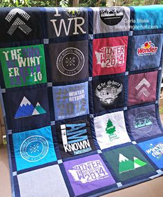 a quilt made to look like it has various logos on it