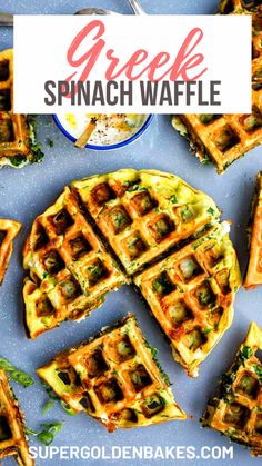 a blue plate topped with waffles covered in cheese and spinach toppings