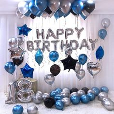 a birthday party with balloons and streamers in the shape of letters, stars and numbers