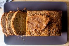 sliced loaf of banana bread sitting on top of a blue plate