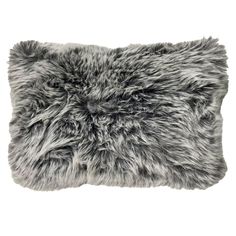 a gray furry pillow on a white background