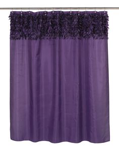 a purple shower curtain with black ruffled trim