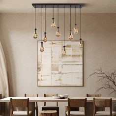 a dining room table and chairs with light bulbs hanging from the ceiling