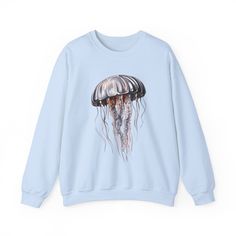 Introducing our stunning sweatshirt that brings the mesmerizing beauty of the ocean to your wardrobe! With its metallic-colored jellyfish design, this sweatshirt is a true standout piece. Picture yourself gliding through the depths of the sea, surrounded by the shimmering glow of these ethereal creatures. The metallic hues capture the iridescent essence of jellyfish, making this sweatshirt a captivating addition to any outfit. Embrace the mystique of the ocean and make a bold fashion statement with our metallic jellyfish sweatshirt. Artist- Anastasiya Khatsanovich Art Name- "Metallic Jellyfish" Designed by Jumping Dots Reproduction rights not transferable with sale COPYRIGHT: Jumping Dots retains all copyrights to artworks. Colors may vary from monitor/printer. Please keep it in mind when Jellyfish Design, Colorful Sweatshirt, Mesmerizing Beauty, L And Light, Bright Designs, Apparel Design, Bold Fashion, Jellyfish, The Ocean