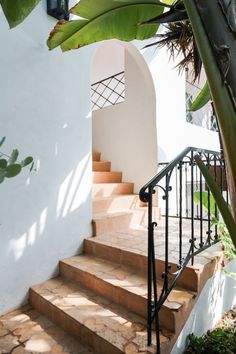 stairs leading up to a white stucco building