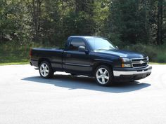 a black pickup truck parked in a parking lot