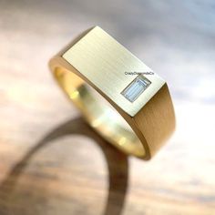 Classic Design Signet Ring, 4X2 MM Baguette Cut Lab Diamond Wide Band Men's Ring, 14k Yellow Gold Satin Finish Ring, Handcrafted Wide Band ✹✹𝐖𝐞𝐥𝐜𝐨𝐦𝐞 𝐭𝐨 𝐂𝐫𝐚𝐳𝐲𝐃𝐢𝐚𝐦𝐨𝐧𝐝𝐬𝐂𝐨✹✹ Detail about stones Moissanite & Simulated Stone: ----------------------------- Stone Shape: Baguette Cut Stone Size: 4X2 mm Weight: 0.14 CT Color: Colorless Cut: Excellent Clarity: VVS Lab-Grown Diamond & Natural Diamond: ----------------------------- Stone Shape: Baguette Cut Stone Size: 4X2 mm Weight: 0.14 CT Color: FG Cut: Excellent Clarity: VS-SI ★ 𝑰𝒕𝒆𝒎 𝑫𝒆𝒕𝒂𝒊𝒍𝒔:- ☛ Metal Purity: Solid Gold (10KT, 14KT, 18KT); Silver(925 Sterling, 935 Argentium), 950 Platinum ☛ Metal Tone: Yellow, White, Rose ☛ Stamp/Hallmark: Yes ★ 𝑪𝒖𝒔𝒕𝒐𝒎𝒊𝒛𝒂𝒕𝒊𝒐𝒏:- ☛ Customized Design Jewelry. ☛ All cuts Cheap Gold Men's Ring In Stainless Steel, Luxury Men's Ring With Polished Edges, Luxury Men's Rings With Smooth Finish, Luxury Men's Wedding Ring With Baguette Cut, Luxury Wide Band Men's Ring For Formal Occasions, Men Wedding Ring Diamond Simple, Luxury Everyday Men's Ring With Round Band, Luxury Men's Modern Ring With Brilliant Cut, Luxury Open Band Men's Engagement Ring