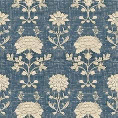 a blue and white wallpaper with flowers on it