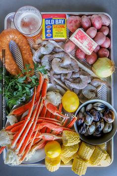 a tray filled with seafood and other foods