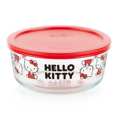 hello kitty glass bowl with red lid and plastic cover on the side, in front of a white background