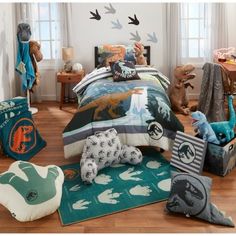 a child's bedroom with dinosaur bedding and stuffed animals on the rugs