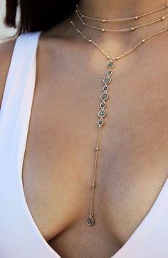 Glittering cubic zirconia stones catch the light on a multichain necklace in 18-karat gold plate. 15" longest strand length; 12 1/2" shortest strand length5" extender 6" pendant drop, 1/4" width Lobster clasp closure 18k-gold plate/cubic zirconia Imported Dope Jewelry, Jewelry Lookbook, Body Chain Jewelry, Girly Jewelry, Dream Jewelry, Lariat Necklace, Pretty Jewellery, Piercing Jewelry, Chains Jewelry