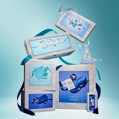 an assortment of items are displayed on a blue and white background with ribbons around them